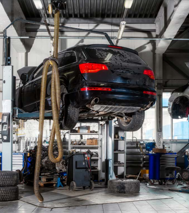 Car getting work done in shop. 